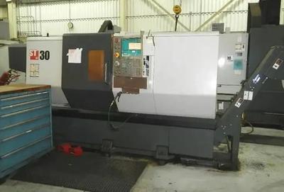 Haas with programmable tailstock and chip conveyor (2012)